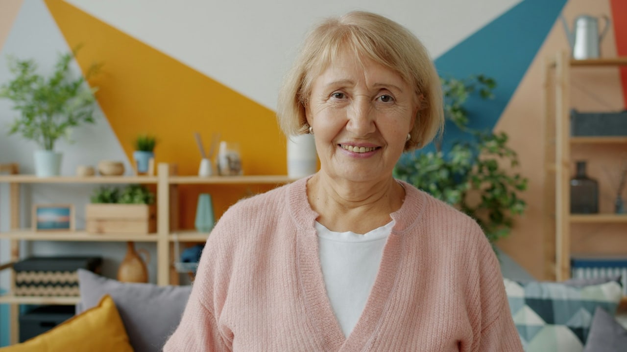A smiling older woman at home