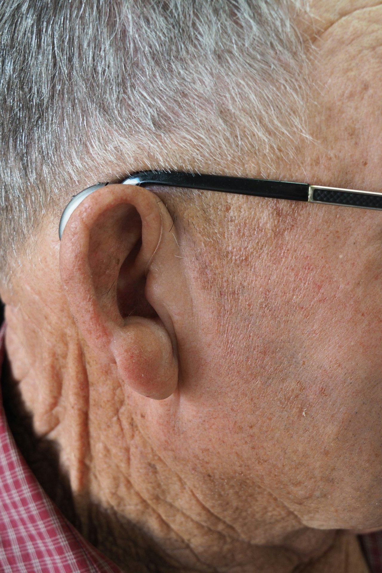 Side view of an older man’s ear